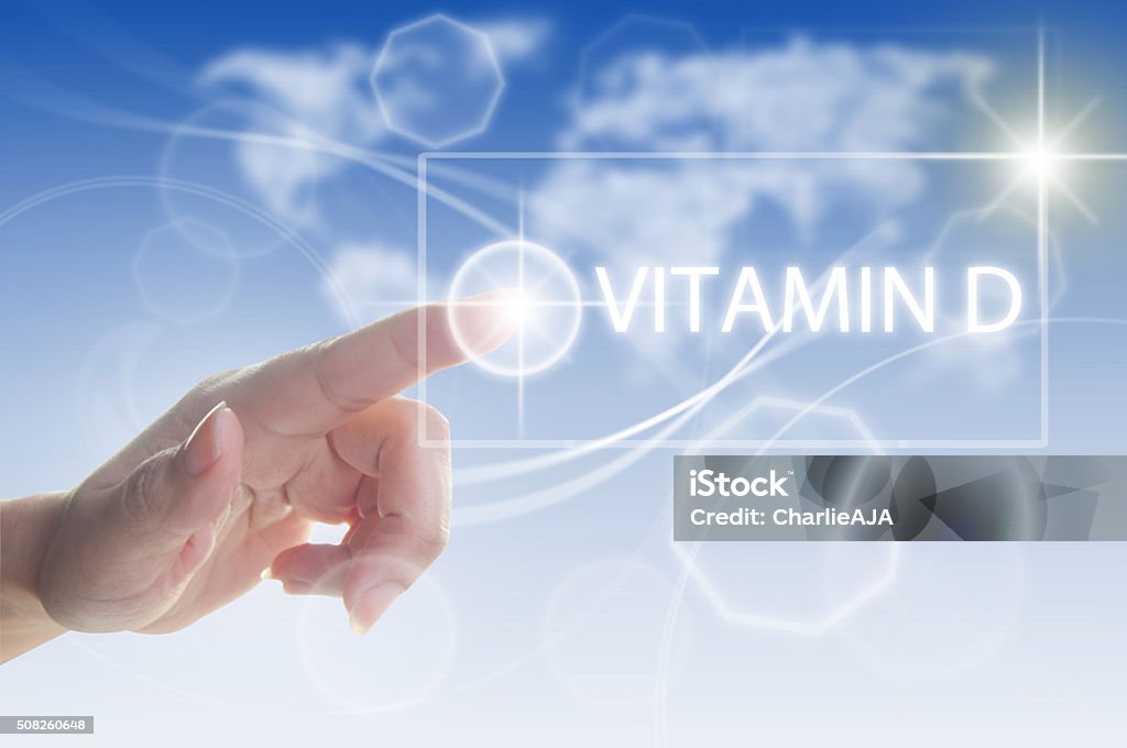 Vitamin D concept Finger pressing touch screen interface with vitamin D Environment Stock Photo