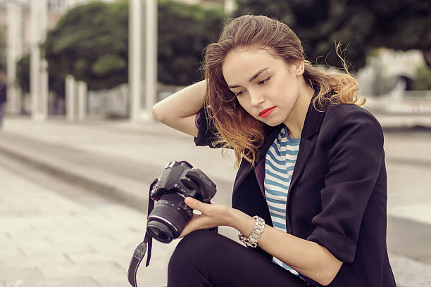 istock Girl sitting on the sidewalk 508261212