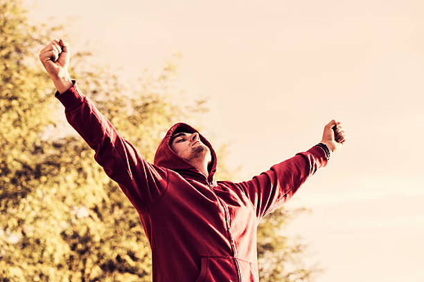 istock Cheerful young man with arms spread open outdoors 508262294