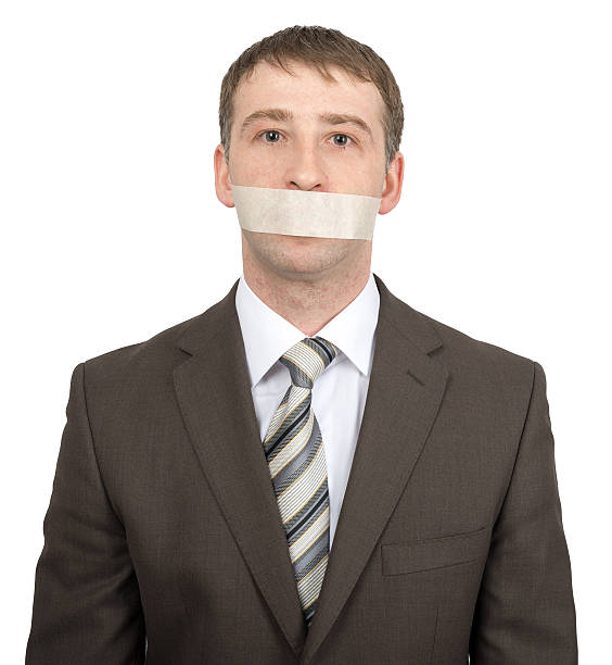istock Businessman with tape over his mouth 508262980