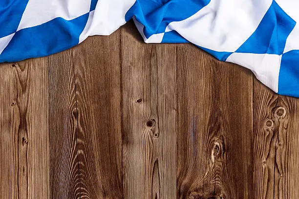 Bavarian flag on wooden board as a background for Beer Fest