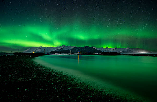 istock Flash of Aurora polaris above water 508273587