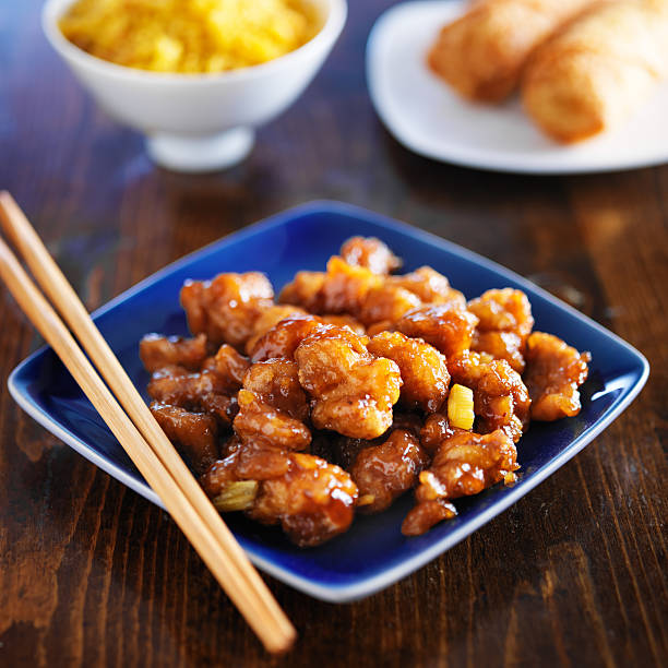 istock chinese food - orange chicken on blue plate 508274563