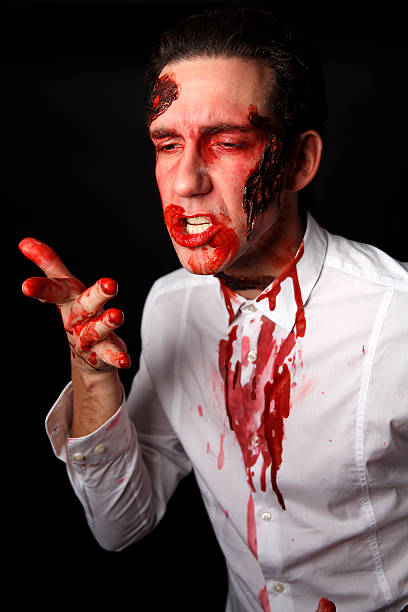 istock Psychopath with bloody fingers 508275575