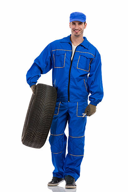 istock young mechanic holding tire 508275661
