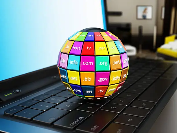 Photo of Domain names globe on laptop computer keyboard