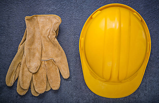 istock Building helmet safety gloves on black background construction c 508284892