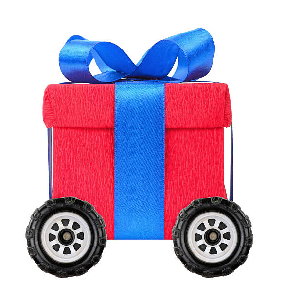 Red gift box with blue ribbon on wheels