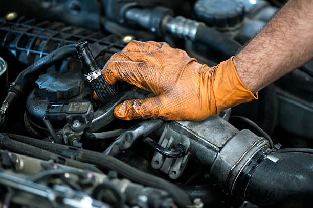 istock Hand of a mechanic on a car engine 508285834