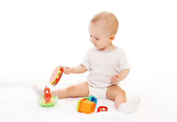 istock Cute baby playing with toys on white background 508287196