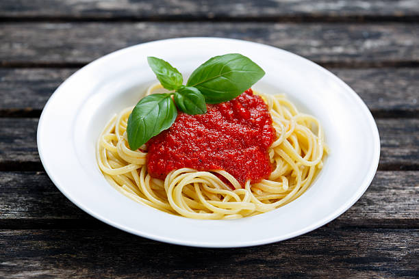 istock Spaghetti with marinara sauce and basil leaves on top 508289224