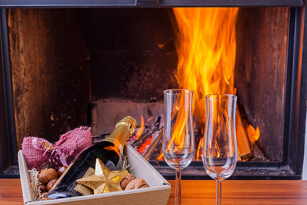 istock champagne for two at cozy fireplace 508290206