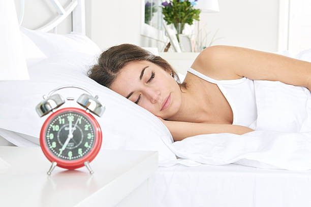 istock Woman asleep in bed 508290320