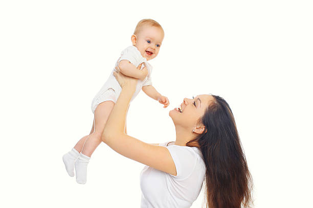 istock Happy smiling mother and baby playing on a white background 508290922