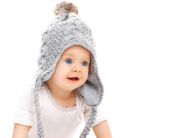 istock Portrait cute baby in grey knitted hat on white background 508291880