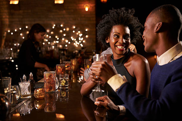 istock Couple Enjoying Night Out At Cocktail Bar 508291882