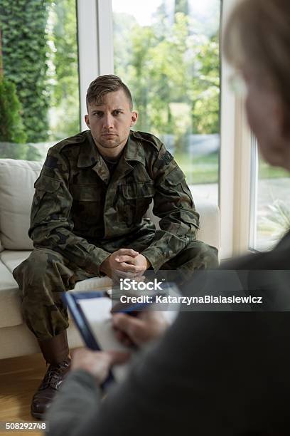 Therapist Diagnosing Soldier Stock Photo - Download Image Now - Healthcare And Medicine, Abuse, Addict