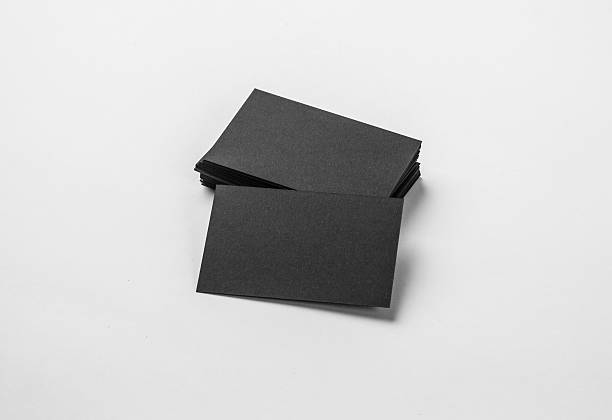 istock Stack of blank black business cards on white background with 508292998