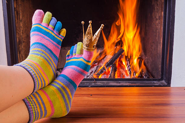 istock relaxing at fireplace in colorful funny toesocks 508293082