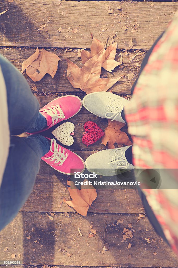 Happy Couple In Love With Their Shoes Stock Photo - Download Image Now -  Above, Adult, Canvas Shoe - iStock