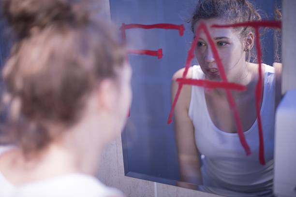 Fat writing on mirror Fat red writing on mirror and teenage girl mirror writing stock pictures, royalty-free photos & images