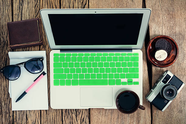 istock Top view of laptop, camera, coffee cup, wallet, glasses, pen 508294376