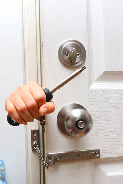 istock bandit hand try to destroy  lock by screw driver 508296746