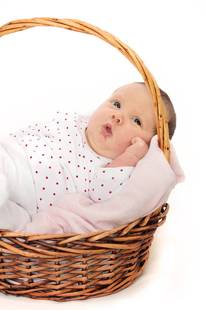 istock Newborn Baby Lying Peacefully in Basket 508298162
