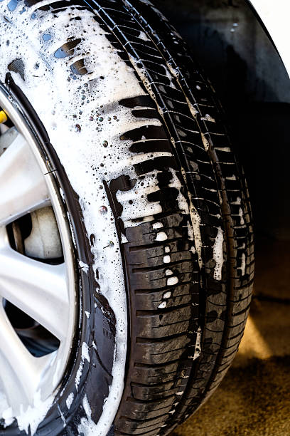 istock close up washing a car tire with soap 508298216