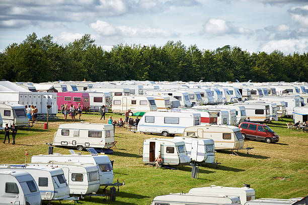 Lots of people have rolled in... Shot of a large caravan park at an outdoor festival music festival camping summer vacations stock pictures, royalty-free photos & images