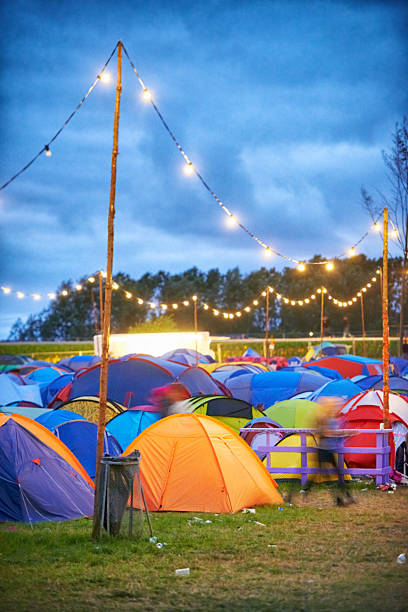 Colorful camp Shot of a large group of tents at an outdoor festival music festival camping summer vacations stock pictures, royalty-free photos & images