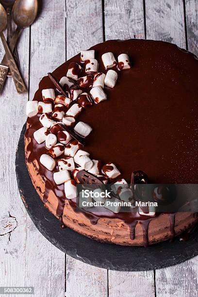 Delicious Chocolate Cake In White Plate On Wooden Table Background Stock Photo - Download Image Now