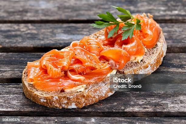 Fresh Homemade Sandwich With Salmon On Old Wooden Table Stock Photo - Download Image Now