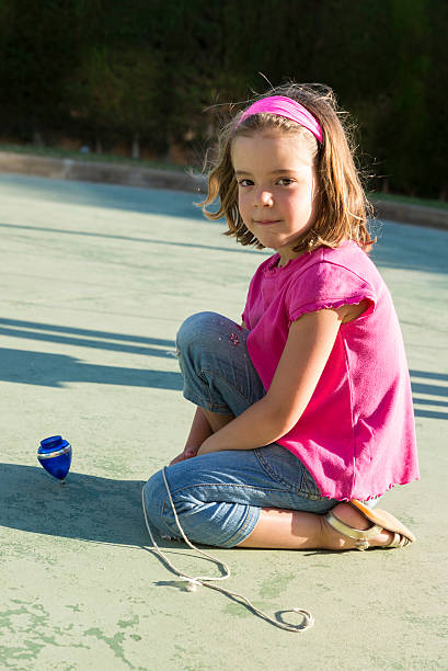 Portrait of beautiful young girl on the playground.