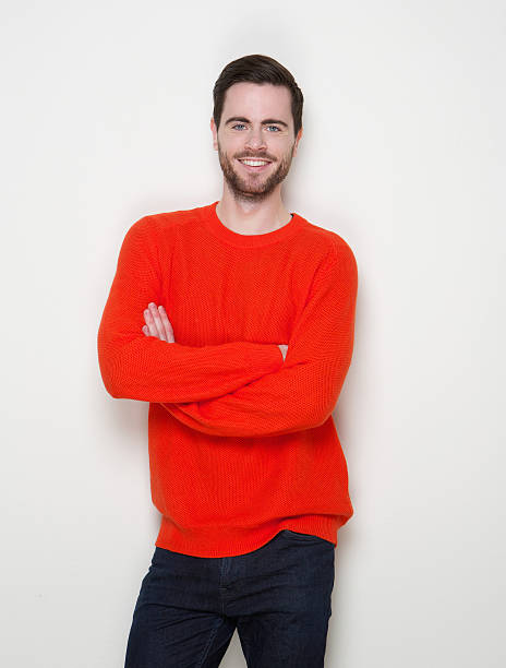 istock One young man smiling with arms crossed 508300677