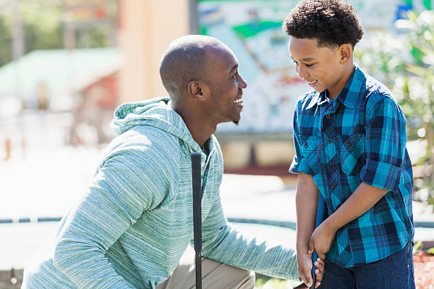 istock Father and son playing miniature golf 508301601