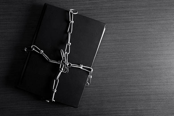 istock Diary tied with chain on wooden table 508302333