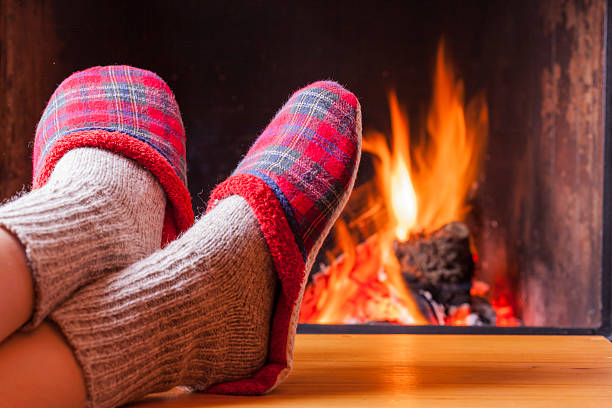 istock relaxing at the fireplace on winter evening 508312668