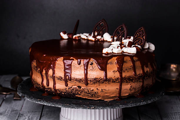istock Delicious chocolate cake in white plate on wooden table background 508315656