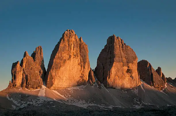 the last rays of the day light up the walls of the most famous peaks of the Dolomite