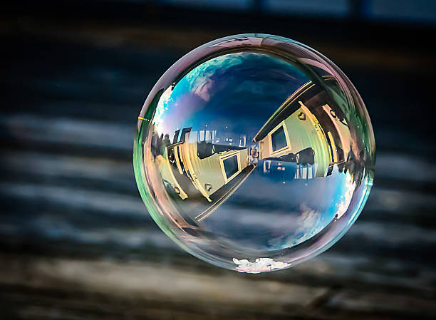 istock Soap bubble with reflection of houses 508316138