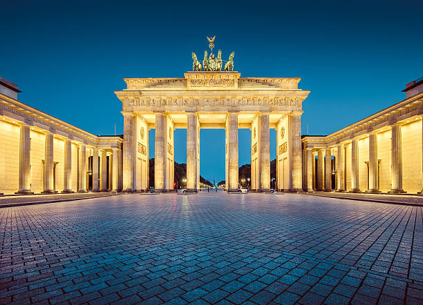 Berlin Brandenburg Gate in twilight, Germany Classic view of famous Brandenburger Tor (Brandenburg Gate), one of the best-known landmarks and national symbols of Germany, in twilight during blue hour at dawn, Berlin, Germany brandenburg gate photos stock pictures, royalty-free photos & images