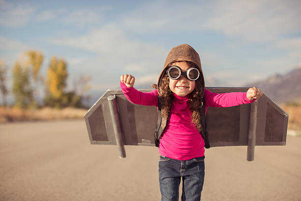 istock Young girl dressed as pilot wearing jet pack 508317418