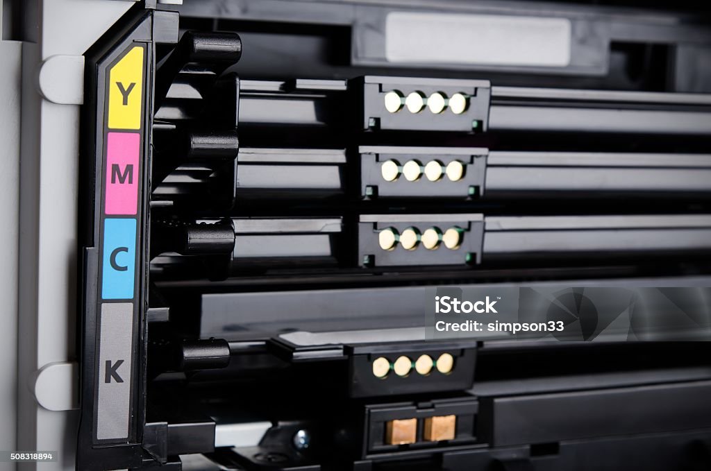 Close up of color laser printer toners cartridges Color laser printer toners cartridges. Computer supplies replacement Black Color Stock Photo