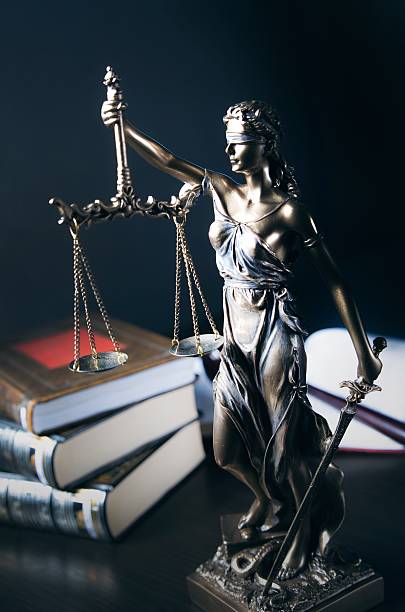 istock Law concept with Themis and books in background 508318962