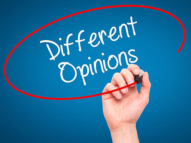 istock Man Hand writing Different Opinions with black marker 508319212