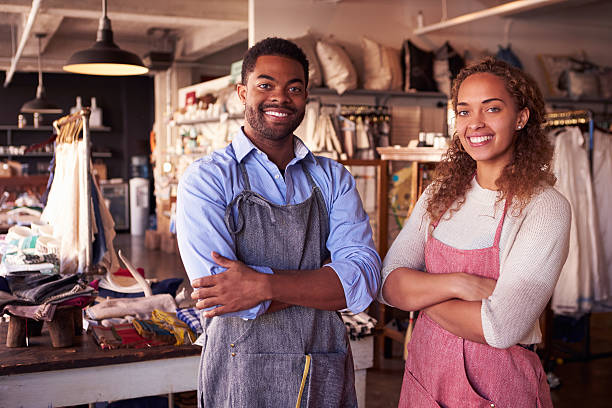 Portrait Of Owners Standing In Gift Store Portrait Of Owners Standing In Gift Store african american business couple stock pictures, royalty-free photos & images