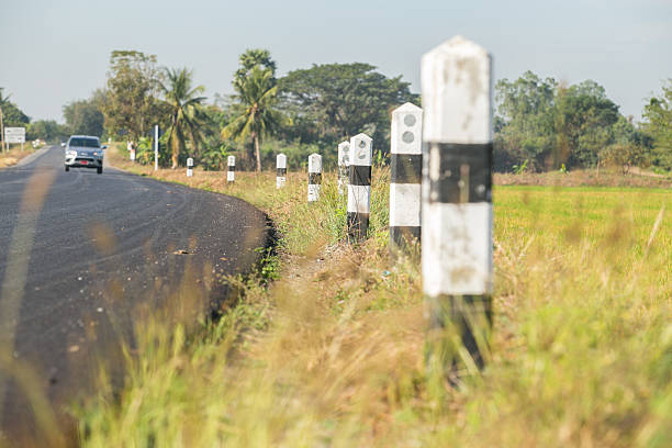 istock Country Road and pillar Through Farmland 508320390