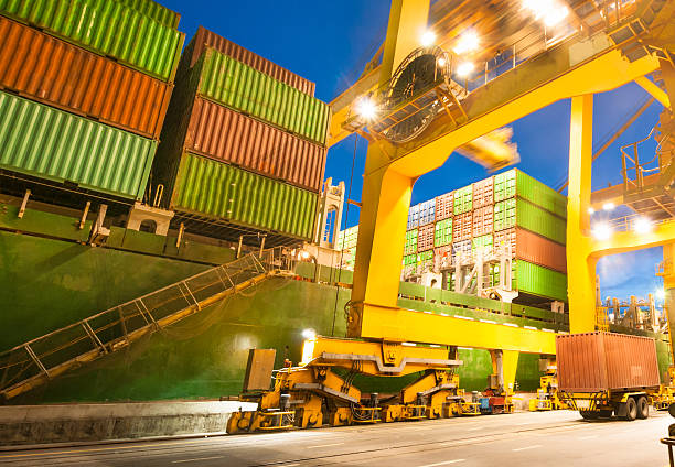 istock Cargo ship in the harbor at sunset . 508322372