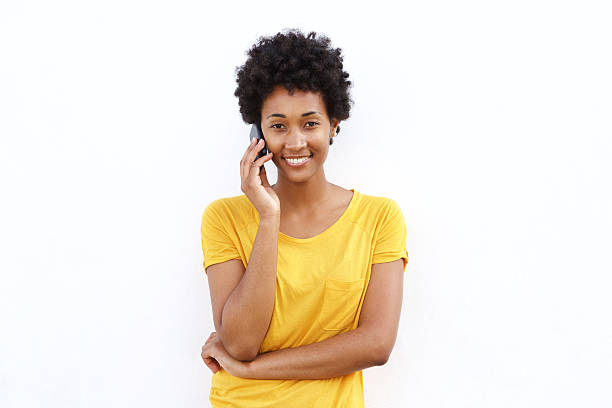 istock Smiling young african woman talking on cell phone 508323548